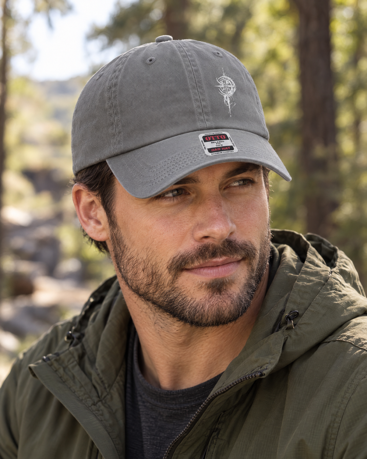 Man wearing charcoal gray Grit With Faith low profile dad hat with embroidered compass outdoors
